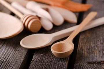 Two wooden spoons on old board