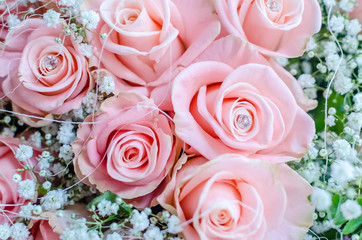 Bouquet of pink roses with small briliants