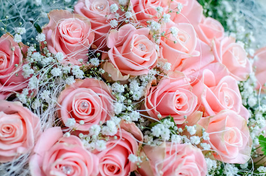 Bouquet of pink roses with small briliants