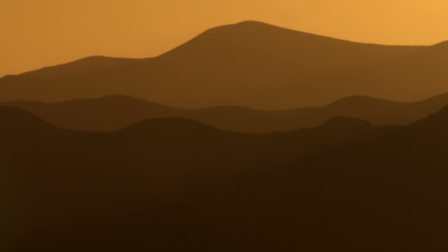 Royalty Free Stock Video Footage of silhouetted mountains at sunset shot in Israel at 4k with Red.