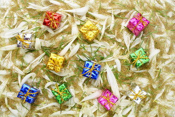 Fototapeta na wymiar Gift boxes on a background of petals