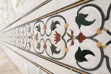 Decorative elements created by applying paint, stucco, stone inlays and carvings