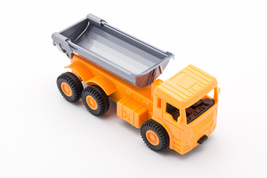 Orange truck toy construction on white background