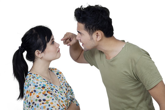 Angry man scolding his wife