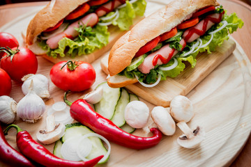 Large hot dog with vegetables