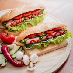 Large hot dog with vegetables