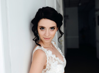 Bride posing in a corridor