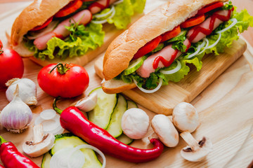 Large hot dog with vegetables