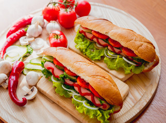 Large hot dog with vegetables