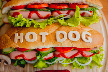 Large hot dog with vegetables