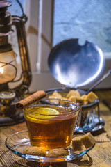 Cup of hot tea with biscuits in a winter day outside the window
