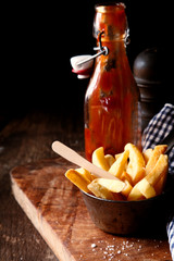 Crispy French Fries with a bottle of ketchup