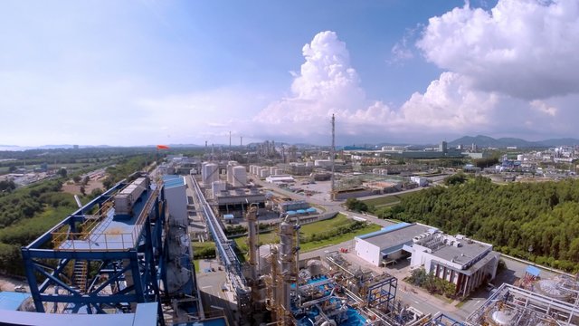 Oil Refinery plant with cloudy sky , Time lapse