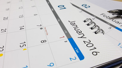 Plan for New Year 2016, Calendar of 2016 with Pen and Notebook on Office Desk