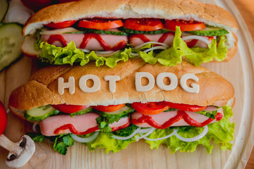 Large hot dog with vegetables