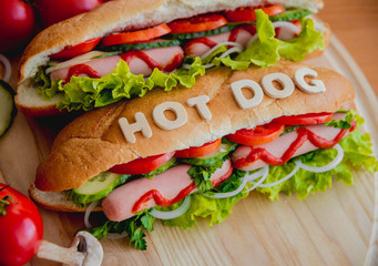 Large hot dog with vegetables