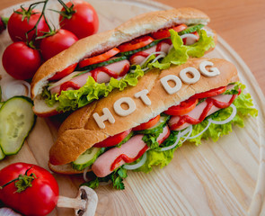 Large hot dog with vegetables