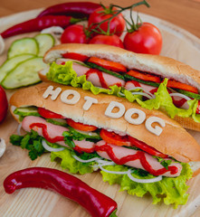 Large hot dog with vegetables