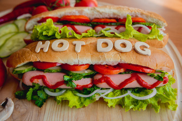 Large hot dog with vegetables