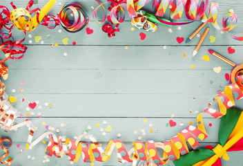 Colorful party frame with streamers and confetti