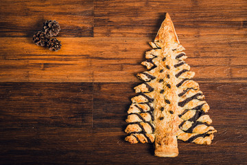 Christmas tree cake on wooden table