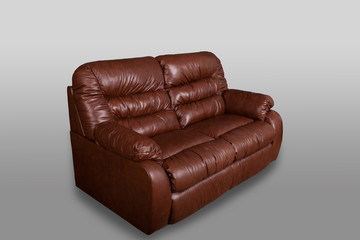 Brown leather sofa on a gray background in the studio