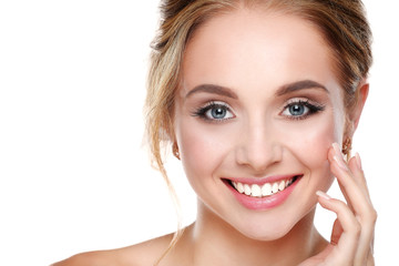 Young woman touching her face isolated on white background