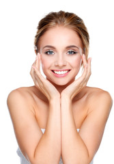 Young woman touching her face isolated on white background