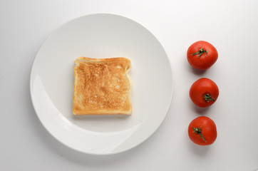 Toasted slice of bread on white plate
