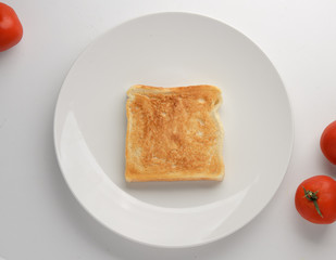 Toasted slice of bread on white plate
