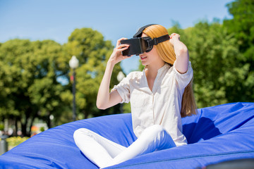 Girl uses head-mounted display in park