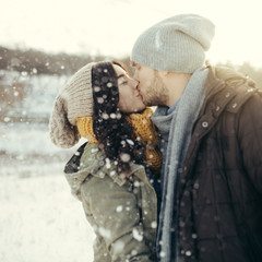 Cheerful young couple walking in a winter day