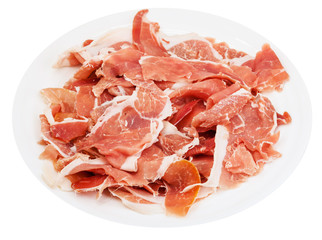 thin sliced jamon on white plate isolated