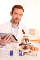 Young attractive man working in a laboratory