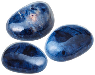 three Dumortierite gemstones isolated on white