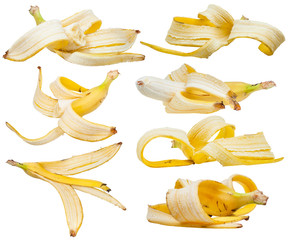 lot of peeled yellow bananas and banana skins