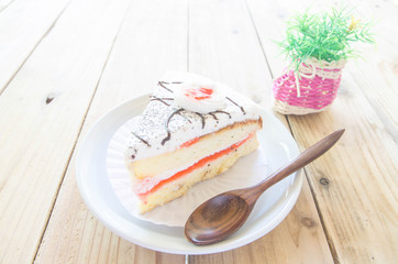 Piece of Vanilla Cake on wood table