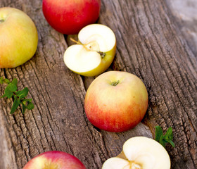 Naklejka na ściany i meble Apples on rustic wooden background