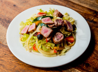 Hot salad with meat and vegetables