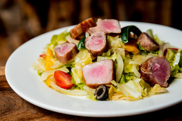 Hot salad with meat and vegetables