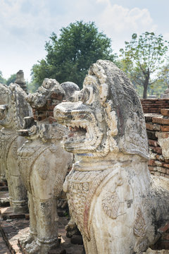Statue lion style cambodia around pagoda ruins. In " Wat Thammik