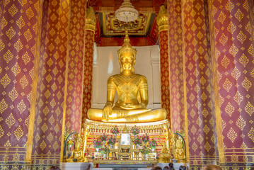 Golden color The crowned Buddha in the ubosot at Wat Naphrameru
