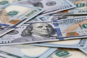 close up of heap of one hundred dollars banknotes