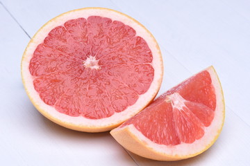 Red grapefruit on a wooden background