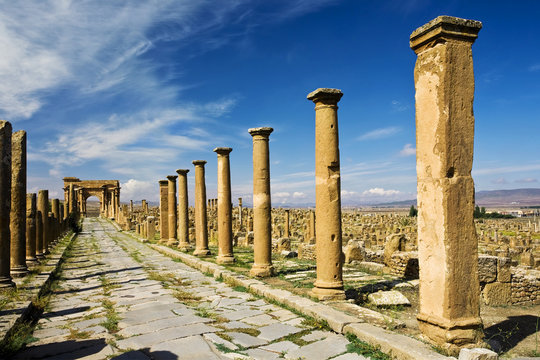 Algeria. Timgad (ancient Thamugadi or Thamugas). Decumanus street and surrounding colonnade terminated Trajan's Arch