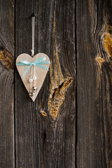 wooden heart hanging on a branch