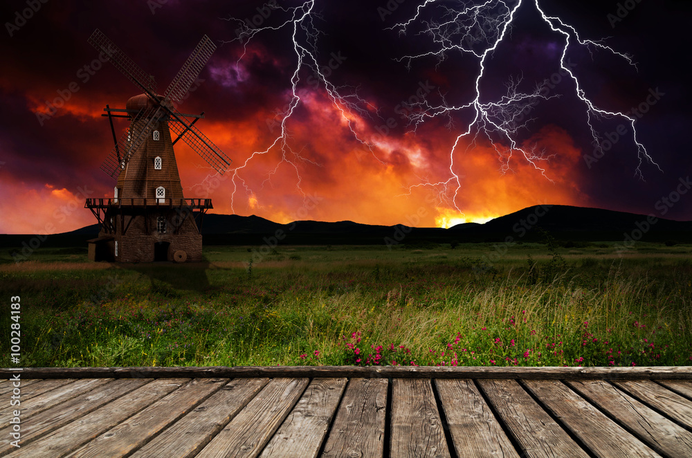 Wall mural windmill in the thunderstorm.
