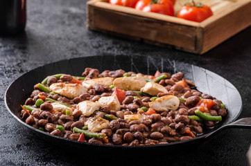 Beans with tomatoes and chicken