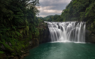 Fototapeta na wymiar Shifen waterfall in Taiwan. This waterfall in nearby Taipei.