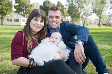 Young family with first baby in the park